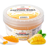 Soeos Mango Popping Boba pearls in bubble tea cup delivering juicy mango bursts.