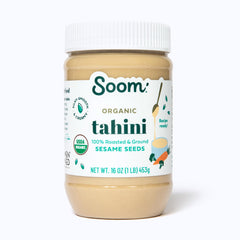 Soom Organic Tahini bottle pouring into hummus for silky texture