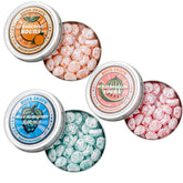 Sour Drops Tangerine tin close-up showing bold sour coating and citrus tang.