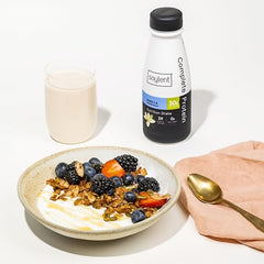 Soylent Complete Protein Vanilla bottle being poured into a glass for on-the-go nourishment.