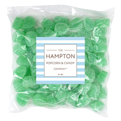 Spearmint leaves candy close-up dusted with sugar, highlighting minty aroma.