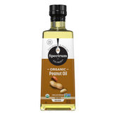 Spectrum peanut oil bottle highlighting organic, expeller-pressed refined oil for versatile cooking.