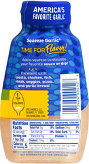 Spice World minced garlic squeeze bottle handle shows convenient, mess-free use.