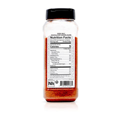 Derek Wolf Nashville Hot seasoning poured over pork chops for flavor