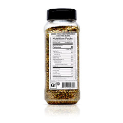 Greek Freak seasoning is poured onto chicken for quick weeknight flavor