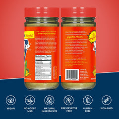 Spike Original Seasoning shaker over grilled chicken for a savory finish.