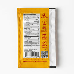 Spread The Love NAKED squeeze pack held in hand, portable workout fuel.