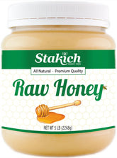 Stakich raw honey 5-pound bottle shows rich amber color, ideal as a natural sweetener.