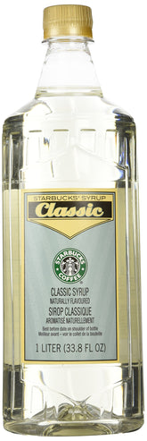 Starbucks Classic Syrup bottle on kitchen counter for at-home drinks.