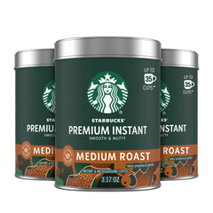 Starbucks Premium Instant Coffee three tins on display for home brewing options