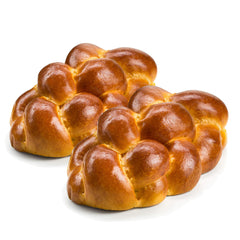 Stern's Bakery challah braid on a cutting board, fresh and soft for Shabbat dinners.