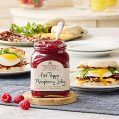 Stonewall Kitchen Hot Pepper Raspberry Jelly on cheese board enhances sweet and spicy contrast