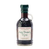 Stonewall Kitchen Maple Blueberry Syrup bottle highlighting rich maple and wild blueberries.