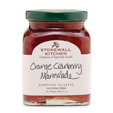 Stonewall Kitchen orange cranberry marmalade jar on counter, ideal for breakfast.
