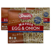 Streit's Egg & Onion Matzo thin crisp sheets beside a warm soup bowl