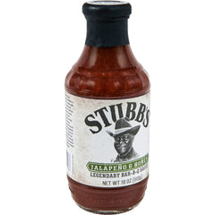 Stubbs Jalapeño & Honey BBQ Sauce bottle on grill enhancing bold Texas flavor