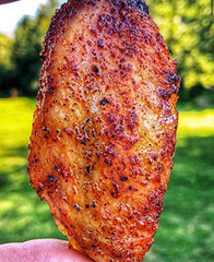 SuckleBusters Clucker Dust dry rub on chicken ready for grilling