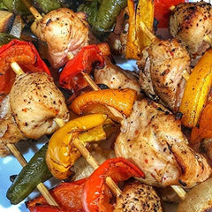 SuckleBusters SPG rub on grilled meat for savory crust.