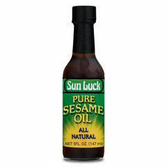 Sun Luck Pure Sesame Oil bottle pour enhances stir-fries with toasted aroma.