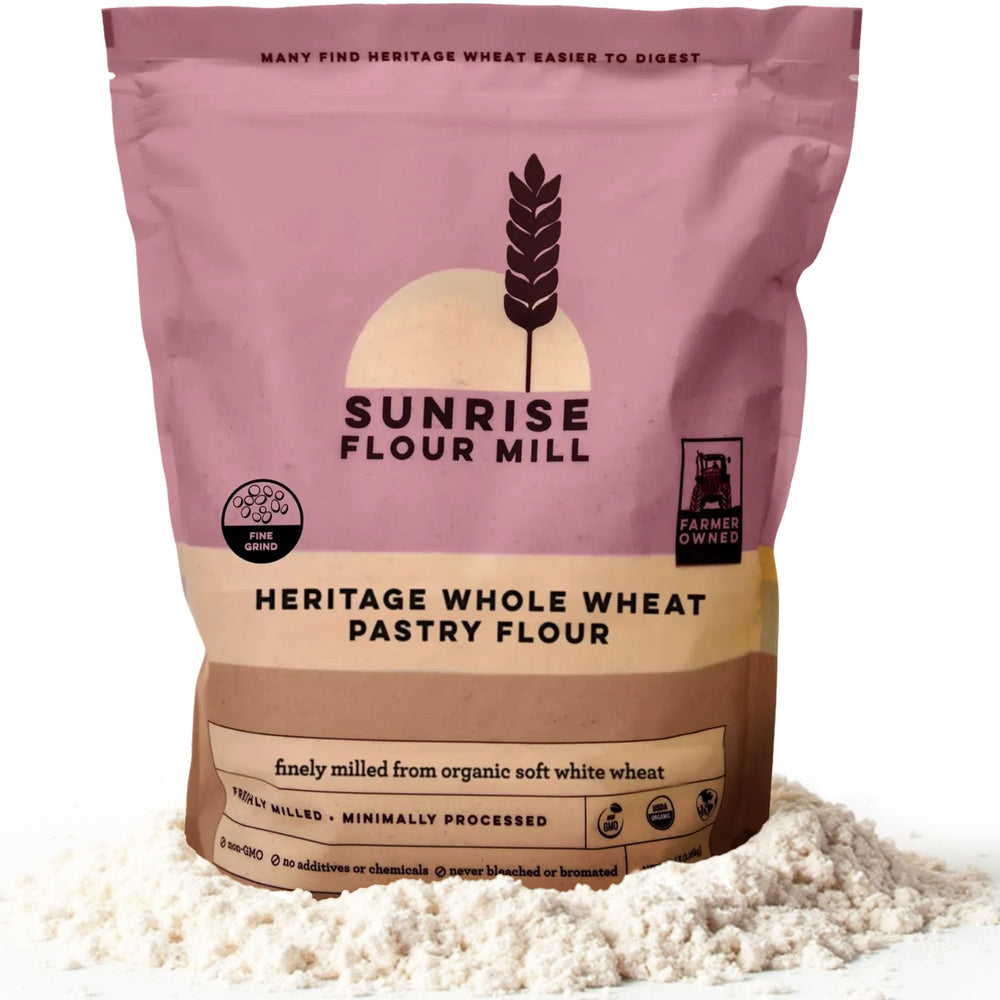 Sunrise Flour Mill heritage whole wheat pastry flour pour highlights a light, airy texture for pastries.