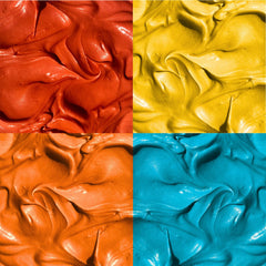 Supernatural orange dye packet close-up adding sunset hues to icing.