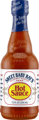 Sweet Baby Ray's Gourmet Hot Sauce bottle pour, adding bold, smoky heat to grilled favorites.