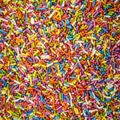 Sweet Eva's Rainbow Sprinkles on cupcakes, adding bright decoration and texture.