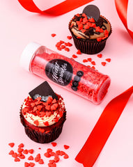 Sweet Spell heart sprinkles on cookies for charming treats.