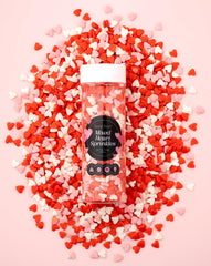 Sweet Spell heart sprinkles pack adds colorful romance to desserts.