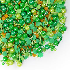 SweetGrove green shamrock confetti sprinkles on cookies and cupcakes.