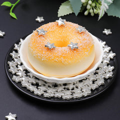 SweetGrove Silver Star Sprinkles on cake for a glamorous touch.