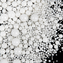 SweetGrove White Pearl Sprinkles on a cake for timeless wedding decoration.