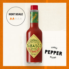 TABASCO Cayenne Garlic Pepper Sauce glass bottle shown in a modern kitchen.