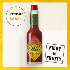 TABASCO Habanero sauce pouring action over food.