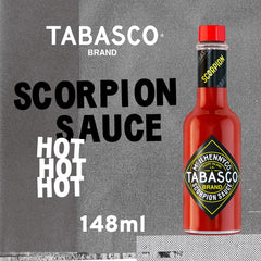 Tabasco Scorpion Hot Sauce pour detail over a dish.