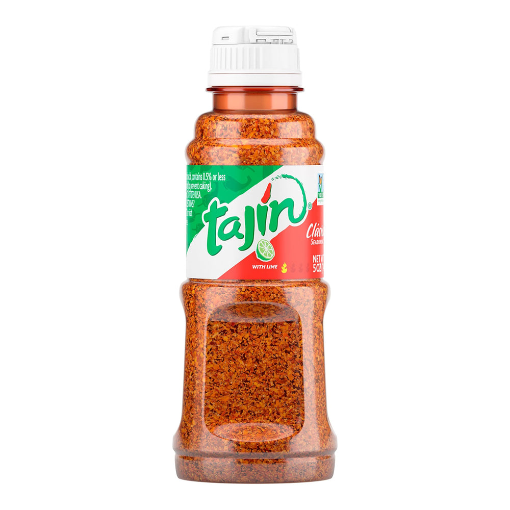 Tajín Clásico 5 oz bottle pouring seasoning adds vibrant flavor to fruits and vegetables.
