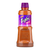Tajín Twist bottle closeup, highlighting the sweet-spicy seasoning for snacks.