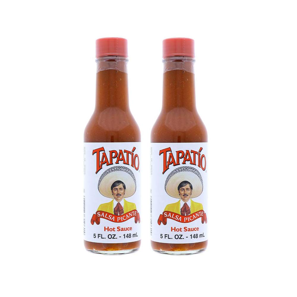 Tapatio Hot Sauce Original 5oz bottle on table adds bold flavor to meals.