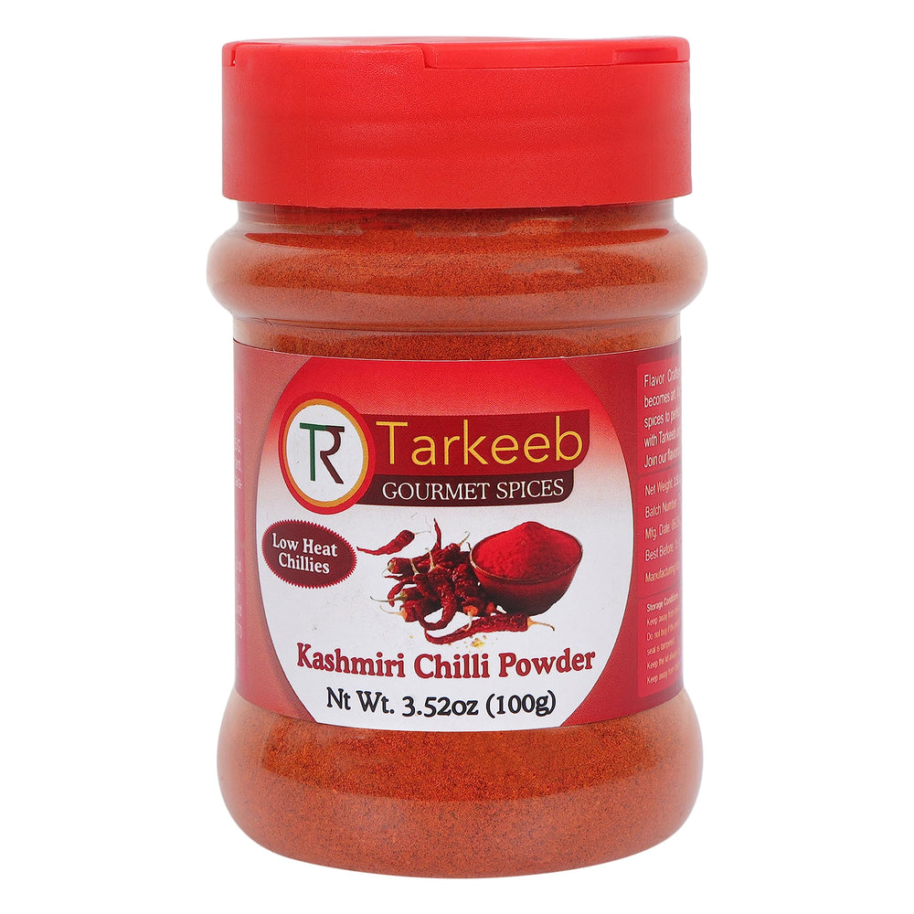 Tarkeeb Kashmiri chili powder bottle close-up showing vibrant color for curries.