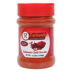 Tarkeeb Kashmiri chili powder bottle close-up showing vibrant color for curries.
