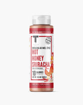 Taste Flavor Co. wing sauce bottle pour enhances spicy, savory wings.