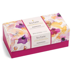 Tea Forte pyramid infuser steeping to release aroma in hot water.
