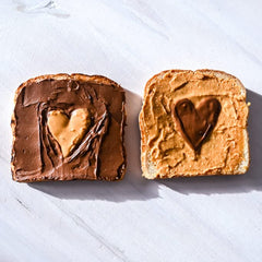 Opened Teddie All Natural Peanut Butter Super Chunky jar reveals chunky peanut pieces.