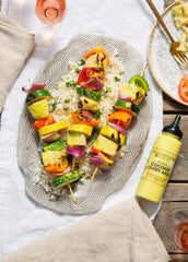 Pouring Terrapin Ridge coconut curry aioli for bold, versatile flavor on dishes