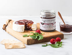 Terrapin Ridge preserves on a cheese board, suggesting snack-ready pairing
