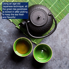 Tetley Green Tea cup with steeped brew showing a smooth, refreshing taste.
