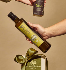 Texas Hill Country Olive Co. Martini glass with brine hints at cocktail customization.