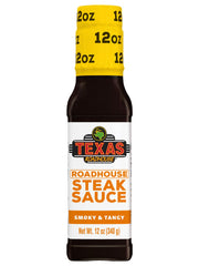 Texas Roadhouse Gold Sauce bottle pouring smoky-sweet glaze over steak