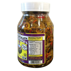 That Pickle Guy muffalata plate close-up, layers of olives and spread ready for serving.