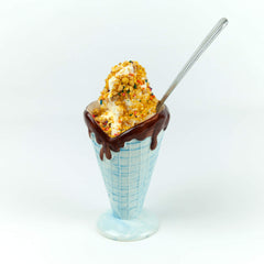 Close-up of The Bulk-Priced Food Shoppe Peanut Brittle Crunch Coat texture on dessert.